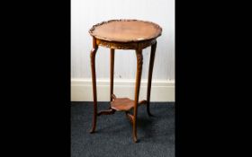 A Late 19th/Early 20th Century Occasional Table In the Arts And Crafts Style with circular top and