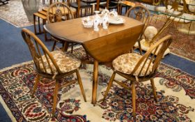 Ercol Drop Leaf Table And Chairs Rustic style table with matching spindle back chairs,