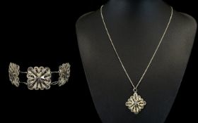 A Middle Eastern Silver Necklace And Bracelet Set Comprising five link bracelet in silver filigree