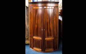 A Georgian Mahogany Cabinet Bow fronted wall mounted corner cabinet. Oak leaf detail inlay to top