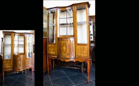 An Edwardian Bow Fronted Display Vitrine Impressive Display Cabinet with central convex cupboard and