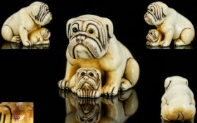 Japanese - 19th Century Fine Quality and Signed Ivory Netsuke of Two Bulldogs - Mother and Baby.