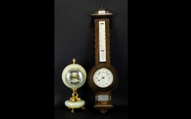 An Oak Cased Barometer with a presentation plaque dated 1930, Height 25 inches.