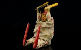 An Early 20th Century Japanese Showa Tinplate Acrobatic Clown Tumbling clown with wind up mechanism