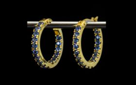 Pair of Sapphire Hoop Earrings, round cut blue sapphires,