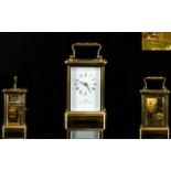 Matthew Norman Superb Quality Brass Cased Carriage Clock with visible escapement, glass panel sides,