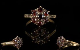 Ladies 9ct Gold Garnet Set Cluster Ring. Flower head Design. Fully Hallmarked for 9ct.