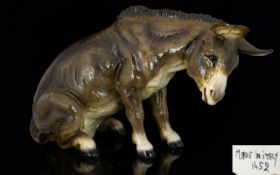 An Italian Ceramic Figure In The Form Of A Seated Donkey Large, lifelike glazed figurine,