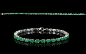 Emerald Tennis Bracelet, 7.5cts of oval cut emeralds in a single row, set in platinum vermeil and