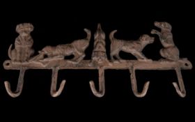 A Cast Iron 5 x Hook Key Rack, Modelled As 5 x Dogs In Different Poses. 14 Inches Long, 6.