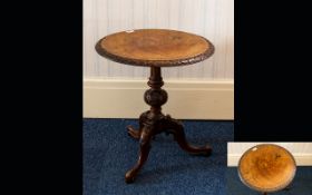 A 20th Century Tripod Table With blind fretwork edges, turned support, inlaid top and tripod legs.