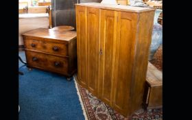 A Panelled Oak Unit Raised On Drawer base with double door cupboard to top.