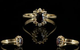 Ladies 9ct Gold - Garnet and Diamond Cluster Ring, Flower head Design.