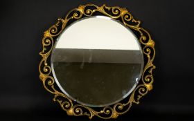 Decorative Mirror Bevelled glass vintage mirror in ornate gilt swept scroll frame. Fixings to back