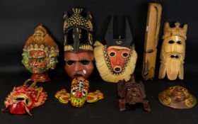A Collection Of Carved Tourist Masks Eight in total to include, Balinese painted mask,