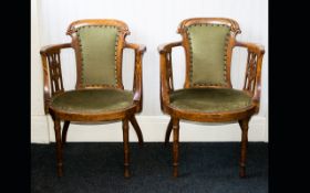 A Pair Of Early Twentieth Century Occasional Chairs Each of circular form with spindle arm rests,