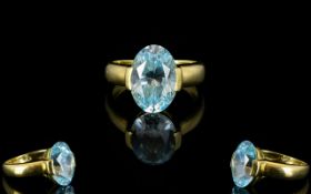 18ct Gold And Blue Topaz Ladies Dress Ring A continental ring with exaggerated shoulders and large