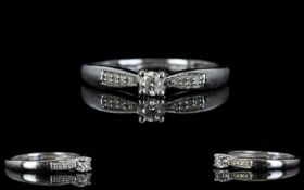 18ct White Gold Diamond Set Dress Ring with Diamond Shoulders. Centre Diamond 0.10 pts. Ring