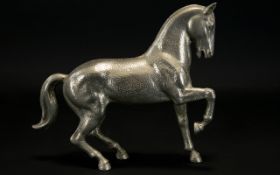 Cast Metal Figure in the form of a prancing horse.