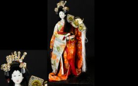 Japanese 1950's Handmade Geisha Doll Figure with Porcelain Face and Arms. The Figure Wears an