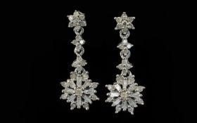 Diamond Pair of Star Drop Earrings, star shapes set with baguette and round cut diamonds,
