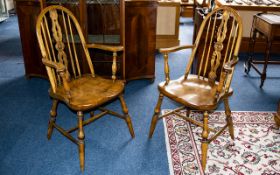 A Pair of Elm Windsor Style Armchairs spindle backs, turned supports. Height 40 inches.