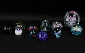 A Collection Of Caithness Art Glass Paperweights (11) in total to include limited edition green
