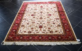 A Large Woven Silk Carpet Keshan rug with beige ground and traditional Middle Eastern floral and