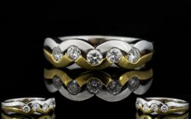 A Ladies 18 Carat White And Yellow Gold Diamond Set Ring Contemporary ring designed in the form of