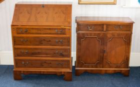 A Walnut Veneer Writing Bureau with Accompanying Cabinet with ribbon stringing throughout,