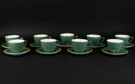A Collection of Nine Midwinter Green Tea Cups with 10 matching Shelly China Saucers