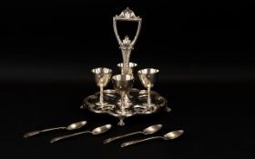 Silver Plated Four Piece Egg Stand of shaped form raised on talon feet. 9 inches in height.