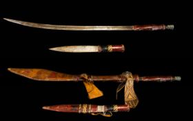 A North African Tribal Dagger. Leather Scabbard With Stitch Work.