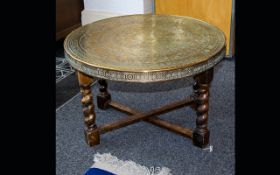 Middle Eastern Brass Table. Engraved Circular Brass Table Top On A Folding Spindle Base.