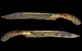 Ceylon PIha Katetta Short Dagger of Characteristic Form with Intricately Carved Elephant Grip.