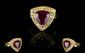 Ruby and White Topaz Trillion Shape Ring, a 6.5ct trillion cut ruby, framed with sparkling white