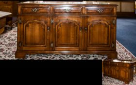 A Stained Elm And Walnut Sideboard By Simpsons Of Norfolk Traditionally made with three frieze