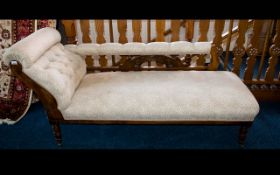 Chaise Lounge Of typical form with carved scroll detail to back and arms,