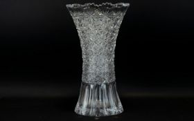 A Large Cut Glass Vase Trumpet form vase with fluted edge and traditional star base.