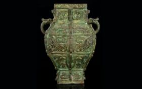 A Late 19th Century Bronze Archaic Style Vase Antique twin handle sectional vase with organic/