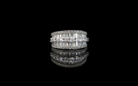 A CZ And Platinum Plated Silver Dress Ring Art Deco style statement ring set with three rows of step