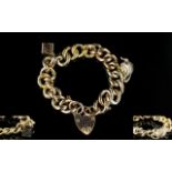 9ct Gold - Two Tone Curb Bracelet - Loaded with Two Charms and Large Heart Shaped Padlock.