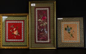 Three Framed Oriental Embroideries On Silk To include rectangular panel with birds and insect
