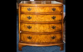 Walnut Veneer Bow Fronted Chest of Drawers raised on square feet with four drawers and brass pull