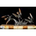 Art Deco Bronzed Metal And Marble Figure Raised on rectangular Rosa marble base with contrasting