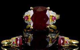 Ruby Cushion Cut Solitaire Ring with ruby and white zircon accents;