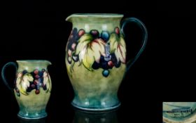 William Moorcroft Signed Leaf and Berry Designer Jug, Signed to Underside of Jug. C.1928 - 1935.