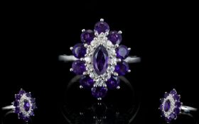 Amethyst and White Zircon Cluster Ring, a marquise cut amethyst framed with a row of round cut