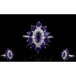 Amethyst and White Zircon Cluster Ring, a marquise cut amethyst framed with a row of round cut