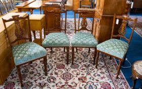 A Set Of Four Edwardian Mahogany Salon Chairs Each with carved inlaid back rests, padded seats and